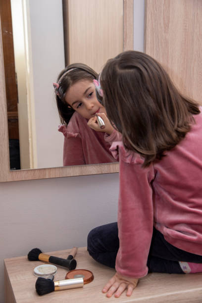 istock A little girl is doing makeup 1437739925
