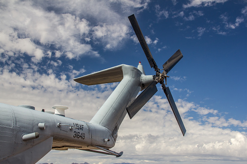 The photo shows the distinctive tail rotor of a  U.S. Air Force MH-53M helicopter, also known affectionately as the \