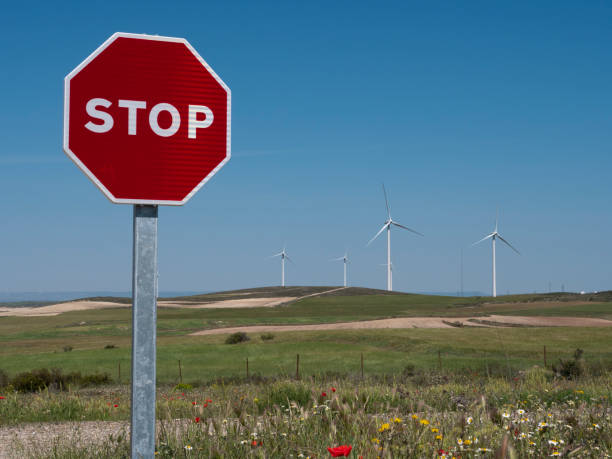 Stop sign on windmills in spring. stock photo