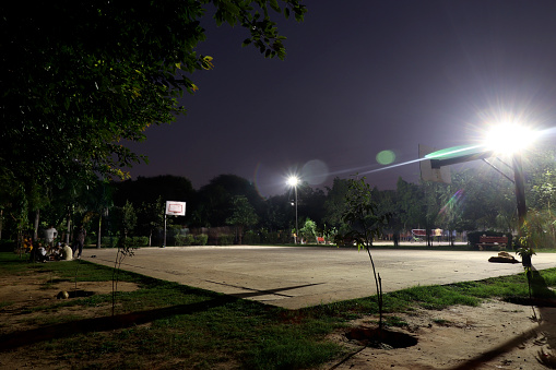 Volleyball stadium at night in Delhi city.