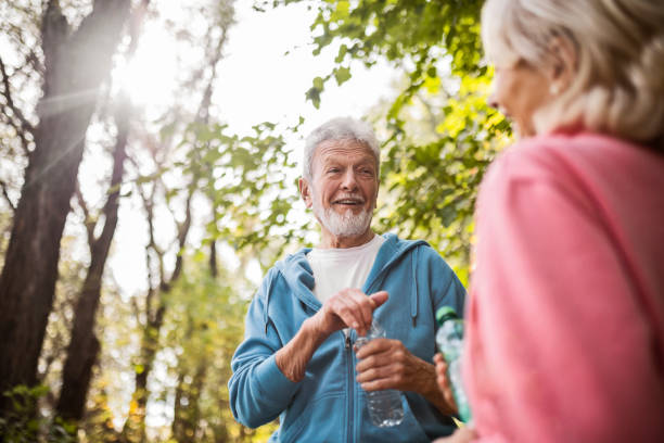 istock Seniors having fun in park exercising 1437742198