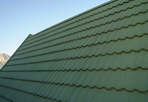 Modern roof covered with green tile