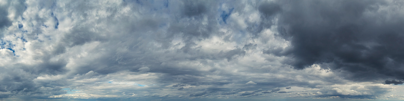 Panoramic skyscape of an overcast sky with rain clouds.