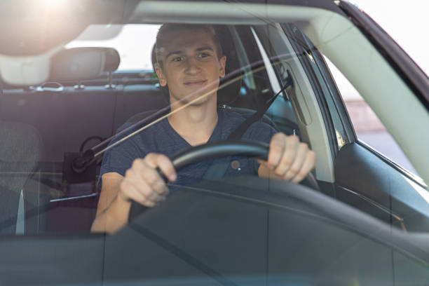 istock Teenage Boy Inside a Car 1437747980