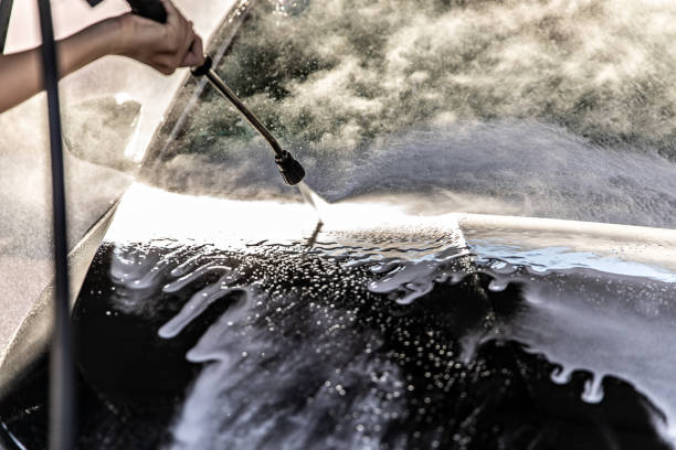istock Man Washing Car at Carwash 1437748000