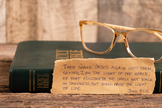 eyeglasses on an old open book