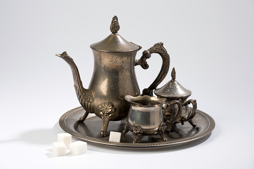 Antique coffee set with sugar on a light background