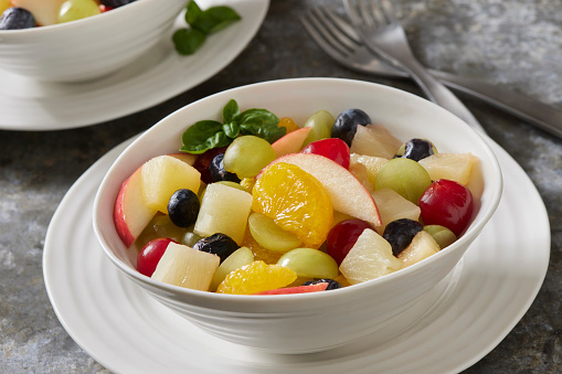 Fruit Salad with Mandarin Oranges, Grapes, Pineapple, Pears, Blueberries, Maraschino Cherries and Fresh Basil