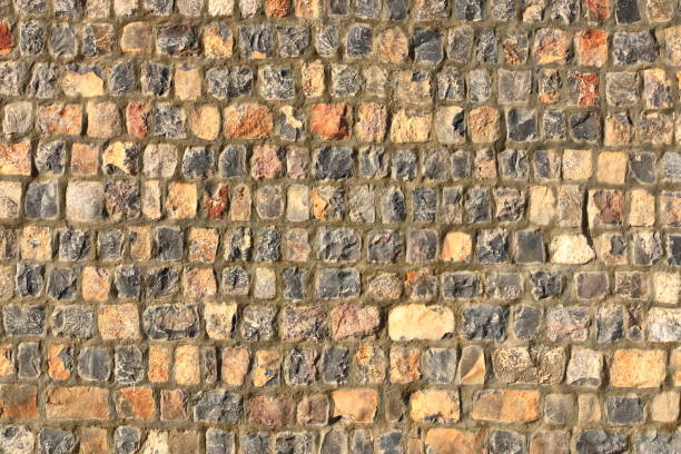 istock Grey Yellow Stonewall Made From Flagstone And Sandstone Slabs Background, Bumpy Stone Wall Texture, Rocky Structure Backdrop 1437751356