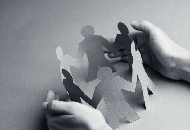 istock Hand Protecting Paper Cut Out Figure 1437752618