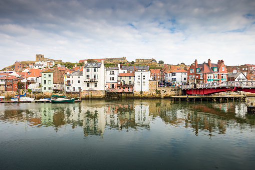 Whitby, UK - September 21, 2022. Waterfront property, scenic view of houses on Whitby Harbour, Yorkshire, UK