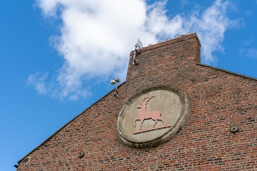 North Shields, United Kingdom – August 03, 2022: Stag deer roundel on the side of Stag Line building, at Maritime Chambers, North Shields, UK  - the North Tyneside Registry Office.