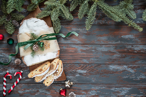 Traditional Christmas pastry dessert – Stollen. Xmas greeting card. View from above.Flat lay style