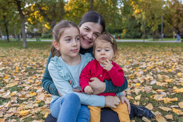 istock Sisters enjoy with their mother 1437755076