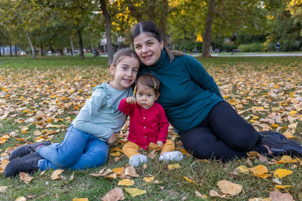 istock Sisters enjoy with their mother 1437755302