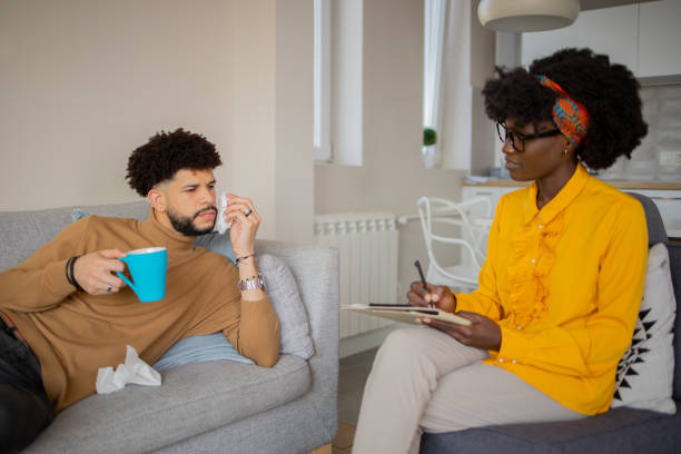 istock Young man having a therapeutic session with a psychologis 1437755347