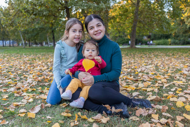 istock Sisters enjoy with their mother 1437755468
