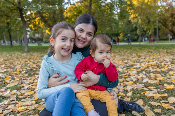 istock Sisters enjoy with their mother 1437755542