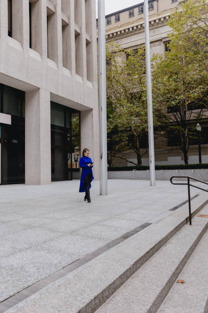 istock Confident Woman Using Cell Phone In The City 1437757500
