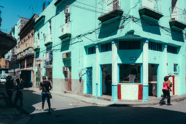 Havana, Cuba - March 18, 2015: Pedestrians walking in the street on a sunny day in Havana, Cuba.