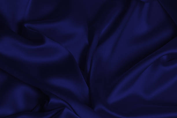 istock Rich and luxury red silk fabric texture background. 1437761490