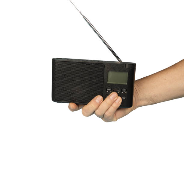 istock a small portable radio in a man's hand 1437762364