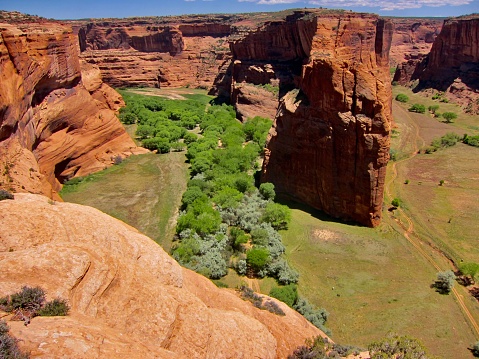 Canyon de Chelly's Chinle Creek is a tributary stream of the San Juan River in Apache County, Arizona. Its name is derived from the Navajo word ch'inili meaning 'where the waters came out'. Canyon de Chelly National Monument is in Chinle, Arizona.