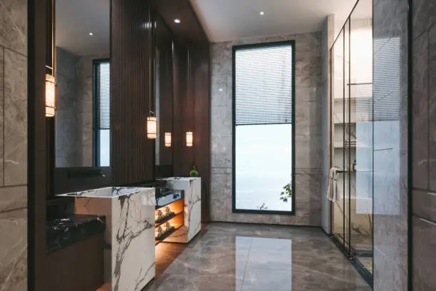 Interior of a contemporary luxury bathroom furnished with marble.