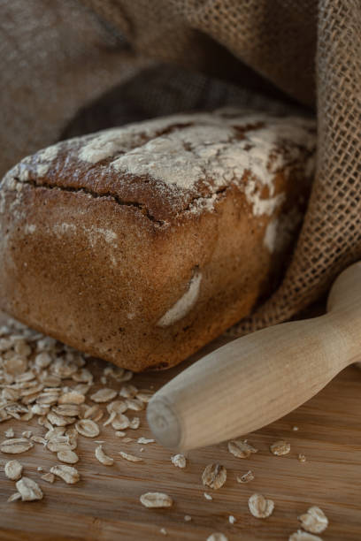 istock Warm bread with oatmeal on a board and burlap 1437768806