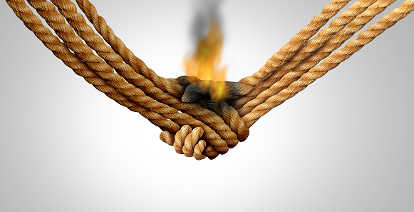 Agreement failure and Business deal fail concept as two hands made of rope in a handshake on fire as a corporate relationship or business crisis and breaking a friendship symbol with 3D illustration elements..