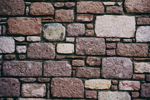 Vertical shot of stone tiles wall, background, texture, pattern.