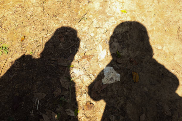 istock shadows of two women on the ground 1437774968