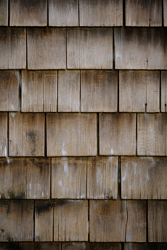 Weathered cedar shingle siding wall.