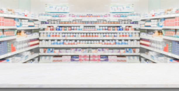 Empty white marble counter top with blur pharmacy drugstore shelves background
