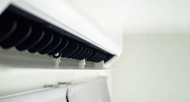 istock Air conditioner on white wall room interior background 1437781243