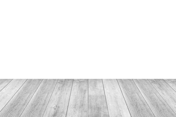istock Empty white wooden table top isolated on white background 1437781275