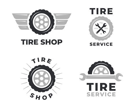 A set of logos with wheels. Emblem tires and wrench. Collection of car repair service badges isolated