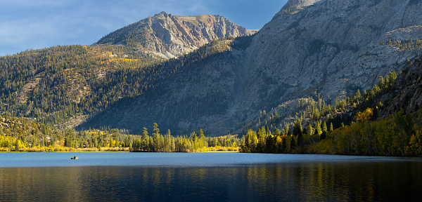 Fall view of Silver Lake with fisherman, California