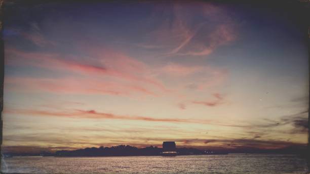 istock Sunset over New York Harbor -Vintage Style 1437788844