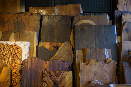 Wooden planks from different trees in the workshop