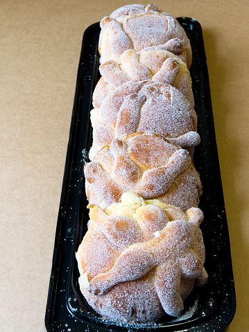 Pan de muerto, small individual pieces, prepared for Day of the Deads in Mexico