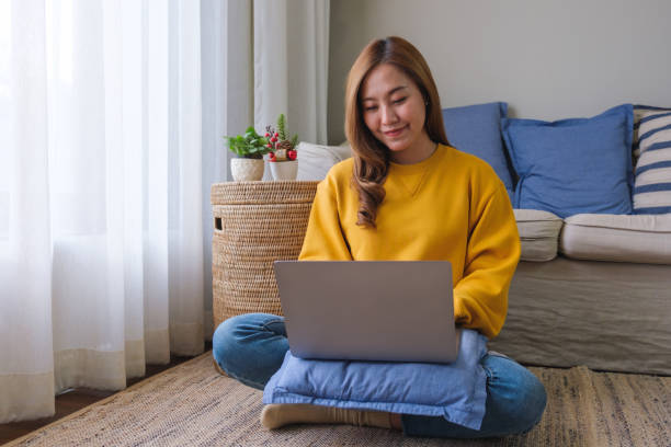 istock Portrait image of a young woman using laptop computer for working and learning online at home 1437805112