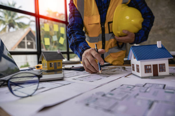 Engineers are working on designing houses for construction on the project. stock photo