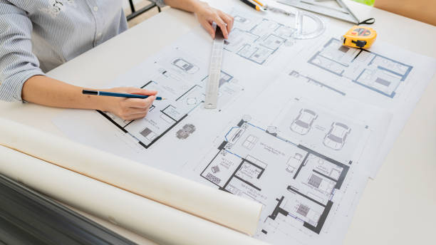 istock Engineers are working on designing houses for construction on the project. 1437805474