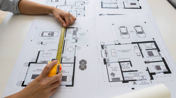 istock Engineers are working on designing houses for construction on the project. 1437805526
