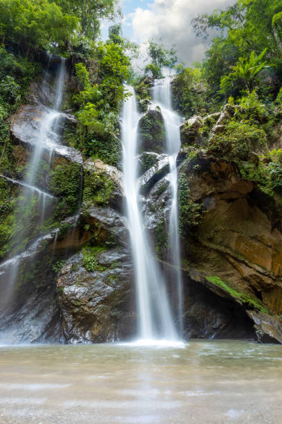 istock Beautiful waterfall in rain forest. Mok Fa Waterfell Changmai Thailand. 1437813079
