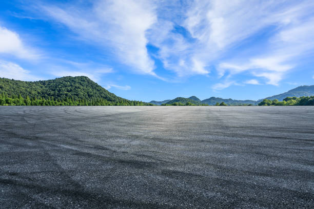 istock Asphalt road and green mountain background 1437820993