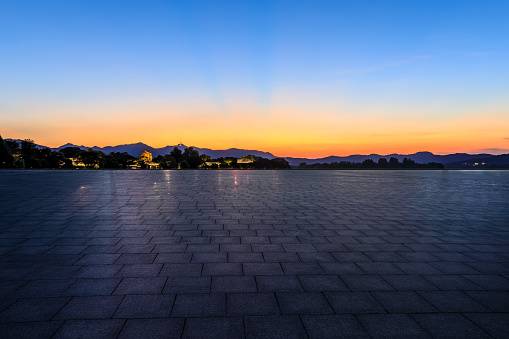 Empty square floor and mountain with sky cloud landscape at sunset