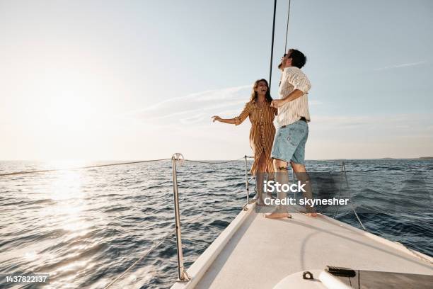 Young Carefree Couple Dancing In Summer Day On A Yacht Stock Photo - Download Image Now