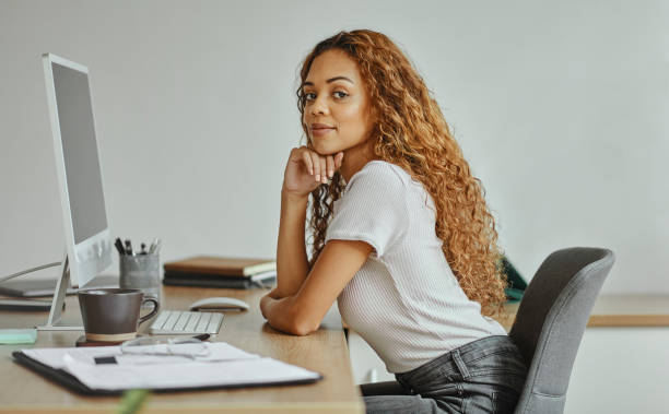 istock Computer, portrait and employee working as a developer for a startup company in an office at work. Creative, young and programming worker at a desk with a pc for coding of software or website 1437822945